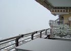 DSC05368  Dusting our balcony with snow