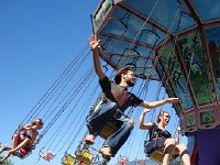 DSC05786  Austin and Nikki take a ride on the swing set up in the Place du Marche-Montreux