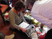 DSCN0805  Mary-Jo inspects the excellent calendar made by Christine for the family