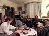 DSCN0835  Nathalie Thibault serves dessert while the dog licks his chops