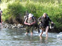 DSCN8302  and she crossed the river after removing her pants, without any foot protection ( I was trying to shuttle my rubber boots back to her), carrying valubles in each hand!