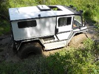 DSCN8494  The wheels are nearly 5 feet high and he was just spinning them in the mud, descending lower and lower