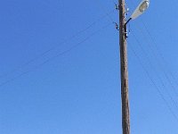 DSCN7767  and what become iconic for me: a two-part power pole, held together by thick steel wire cinched tight by twisting with a crow bar