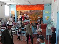 DSCN7790  We used a little theater with a typical Kyrgyz scene of mountains and horses as backdrop