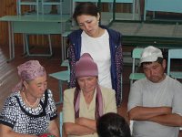 DSCN7800  The villagers pondering with a project staffer backing them up