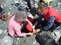 DSC06191  Christine being helped by Ladat with her crampons