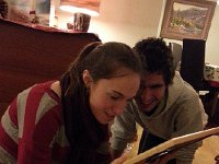 20141224 212111  Together they examine photos from Thanksgiving framed by Christine