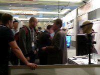 20140108 110448  This is the Innovega booth where they are showing contact lenses that work with glasses