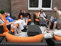 DSCN1868  All the sisters together and 2/3rds of the brothers-in-law together with the new great grandfather!