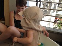 IMG 1613  Back on the balcony Val tries out the bathtub sized swimming pool.