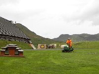 DSCN3335  Modern Viking mowing the lawn outside the Long House