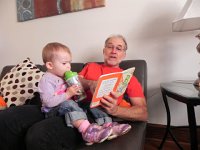 DSCN5282  and being read to while sucking down a remarkable amount of milk