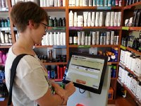 20150923 122519  Vivi signs in to get a hair cut, which she needs so badly