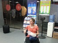 20160614 195915  Nikki waiting with us at the bus station from whence we will head to the airport