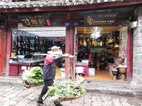 DSCN6534  We headed off to find the house of an important scholar, passing on the way vendors of you-name-it