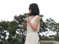 DSCN6645  Young lady hawking perfume