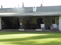DSCN8416  Looking at the family photo on the veranda