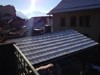 IMG 0056  Snow dusts the roof at the train stop in Planches