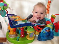 IMG 3668  When sitting in the amusement center, he smiles for me also! Thirty days after this photo (my last day!) he learned how to bounce which introduces a whole new dimension to the center