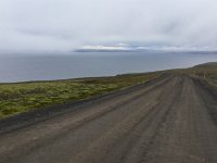 IMG 3180  then south on a gravel road, up over a peninsula (so into the fog) then down.