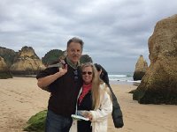 IMG 5420  Maggie and Alan among the remains of land, washed away and leaving shapes on the beach.