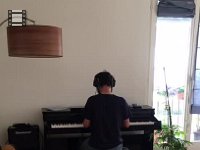 AFRN4238  Nikki enjoying the piano we brought from David&#39;s house to the apartment in Zürich