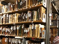 IMG 6796  After the panel discussion we went to an open house at the Geneva municipal library which is attached/closely connected to the University of Geneva. The event started off slowly and then we went into the stacks. The white labels are a change in filing system being implemented due to a move of 15,000 volumes of historical interest to another facility. One interesting thing I learned is that these books are arranged by size, not topic or author!