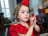 IMG 6624  The flamenco dancer&#39;s dress I bought in Seville is PERFECT size for Val. She even lets me put the bow in her hair and she is curious about the castanets.