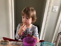 IMG 6693  and, after nap, Val eats another muffin cake while the eggs are dyeing