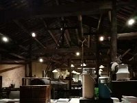 IMG 4145  Post-dinner browsing the books in the re-purposed rapeseed factory that is now the Pig&#39;s Inn