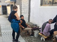 IMG 7027  Conferring with chestnut shellers set up outside their homes