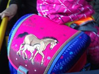 Followed by mare with foal - typical little girl backpack