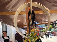 girls in traditional dress with cheese making décor