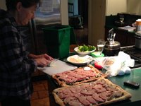 Lucy preparing Greek pizza