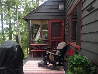 the screened-in porch and then the deck with Adirondack chairs (all made of synthetic, non-rotting material.