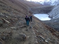Passing a cold little lake behind the moraine