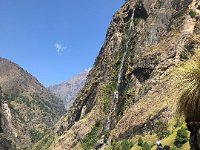 Trail along the canyon wall with waterfall