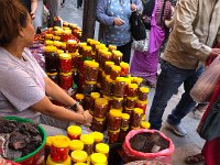 Past chunks of red and black salt and mounds and jars of chillies
