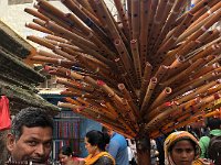 back out in Indra Chowk, this mobile merchant was playing the instruments he sells