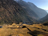 vertical panorama looking down valley to the village from the monastery