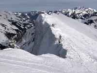 Two other people showed up and looked off the summit cliffs