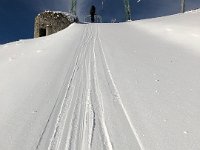 Thin layer of new snow on T-bar track