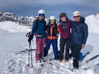 Bri with ski buddies and ski buddy father