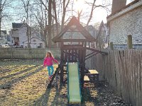 Said yard has play structure and a swing set