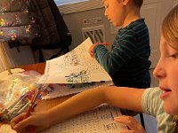 Back at the AirBnb, coloring and word searches were underway