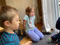 We decided to take the play to the sliding glass door where Val and Liam were inside while August stayed suited up outside
