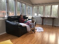 August bumps along in a little red wagon in the second living room. So much light!